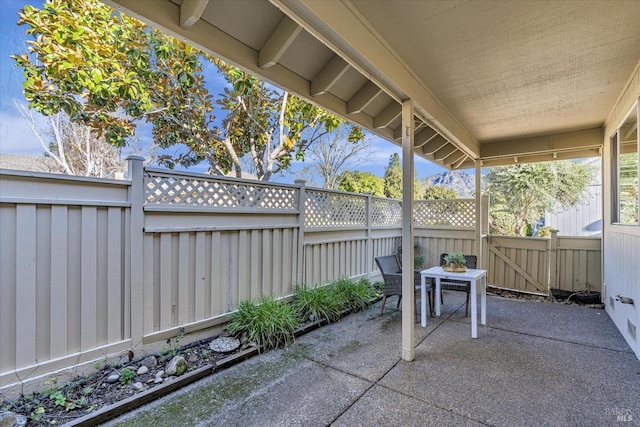 view of patio with a fenced backyard and a gate