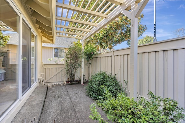 view of patio / terrace featuring a pergola and fence