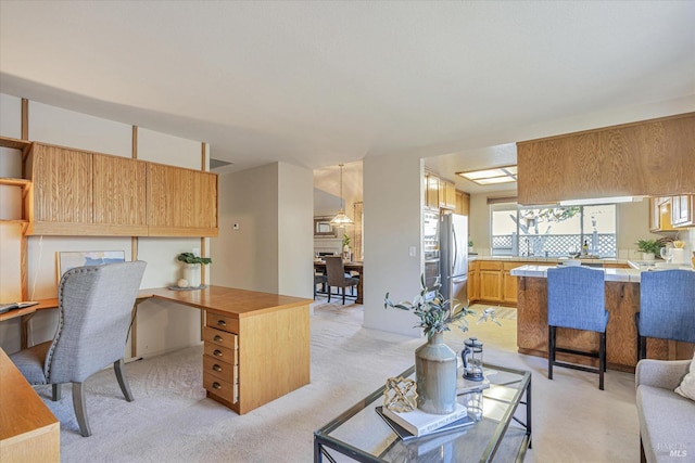 living area with light carpet and built in desk