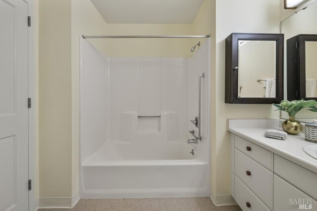 bathroom with bathing tub / shower combination and vanity