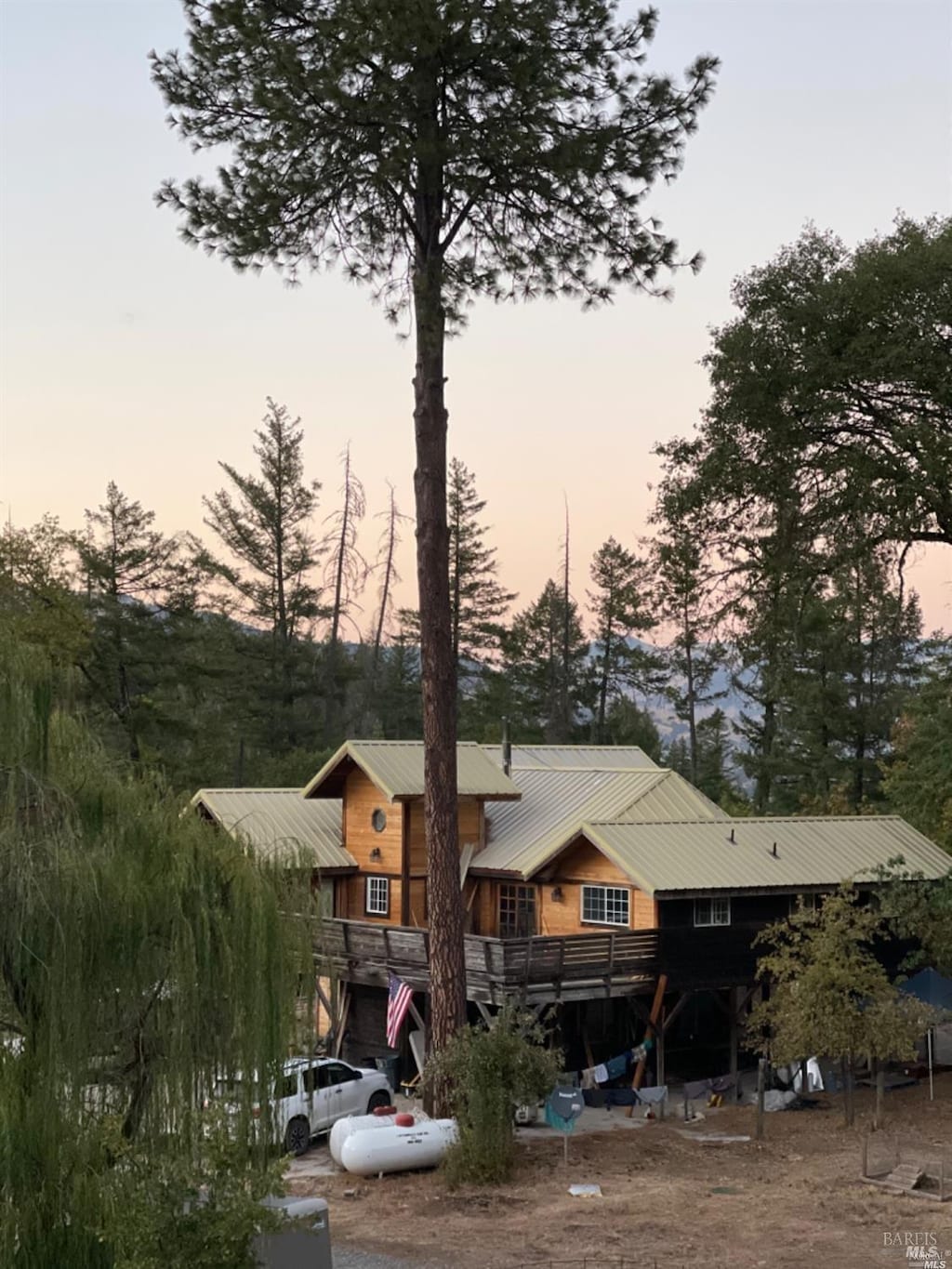 view of back house at dusk