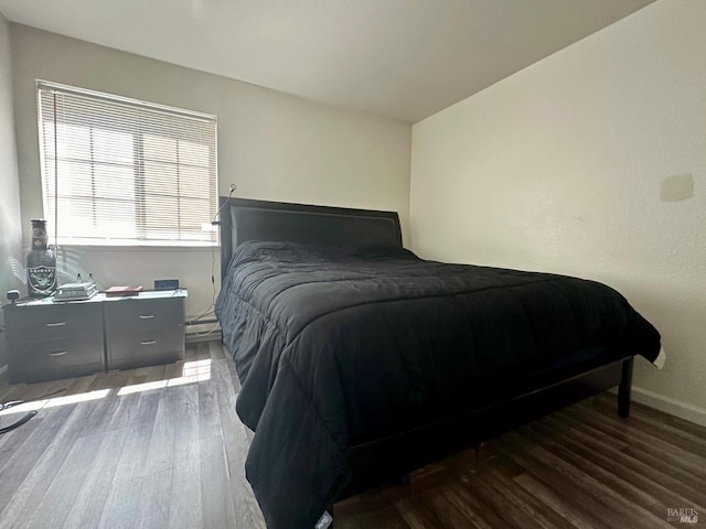 bedroom featuring dark hardwood / wood-style floors