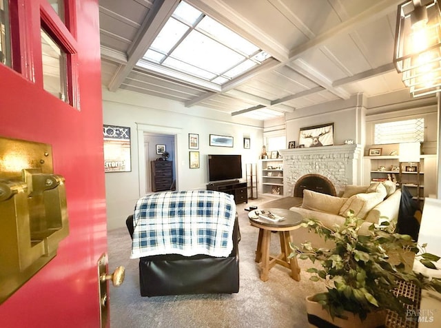 interior space with a brick fireplace and carpet floors