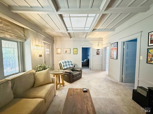 living room featuring light carpet, coffered ceiling, and beamed ceiling