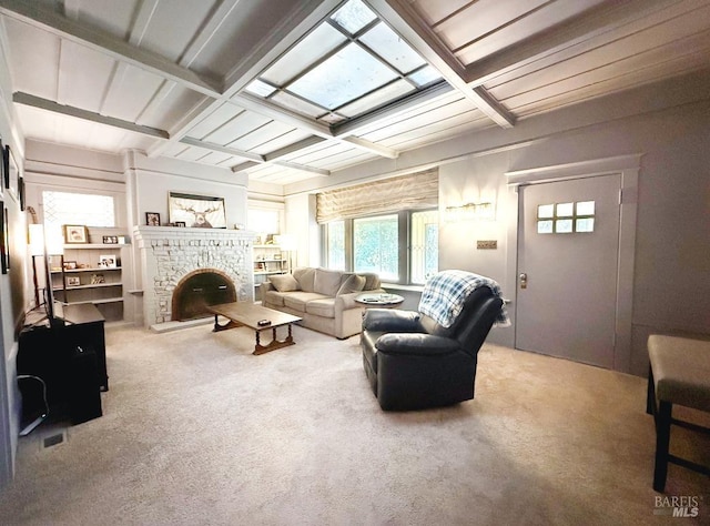 living room featuring carpet, a brick fireplace, beamed ceiling, and coffered ceiling