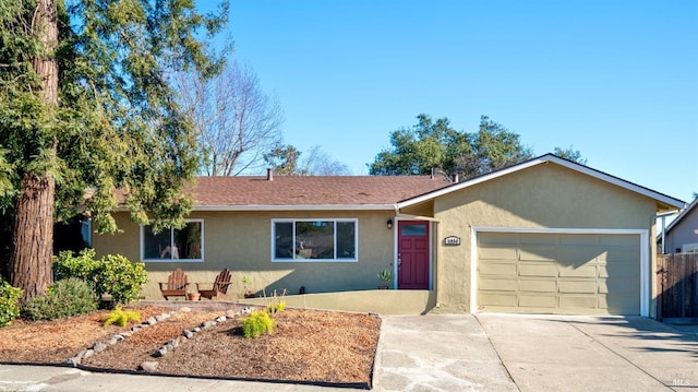 ranch-style home featuring a garage