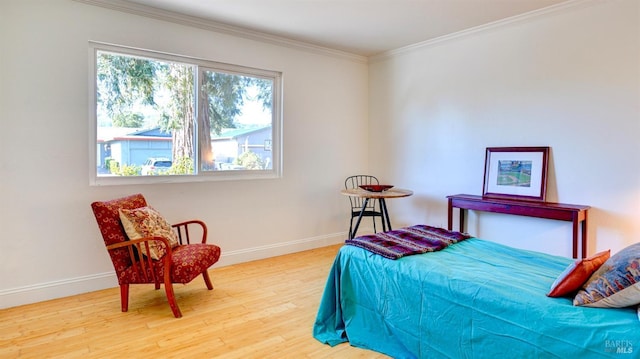 bedroom featuring crown molding and hardwood / wood-style floors