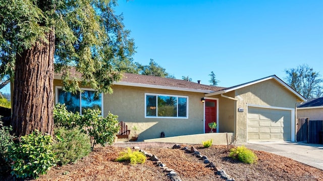 ranch-style home featuring a garage