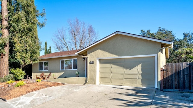 ranch-style home with a garage