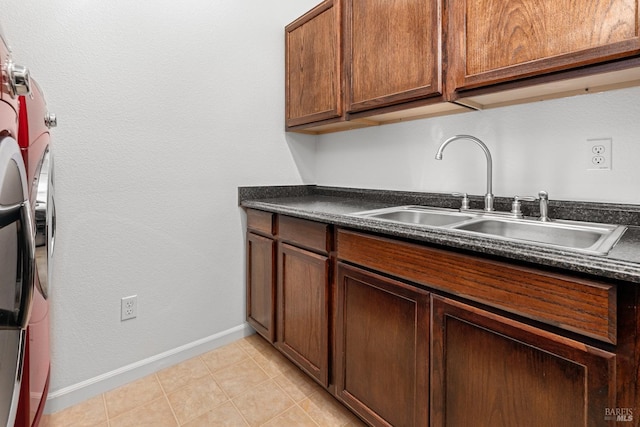 kitchen featuring sink and light tile patterned flooring