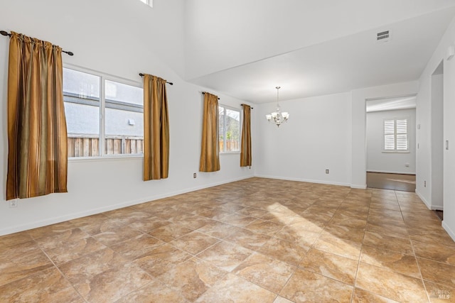 empty room featuring a notable chandelier