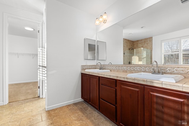 bathroom with walk in shower and vanity