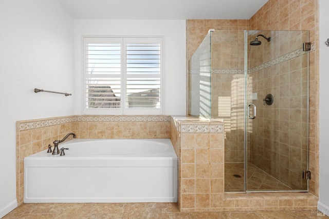 bathroom featuring separate shower and tub