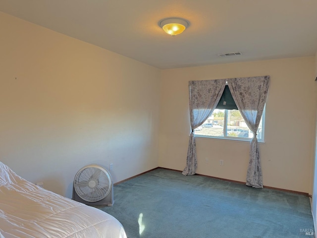 carpeted bedroom featuring visible vents and baseboards