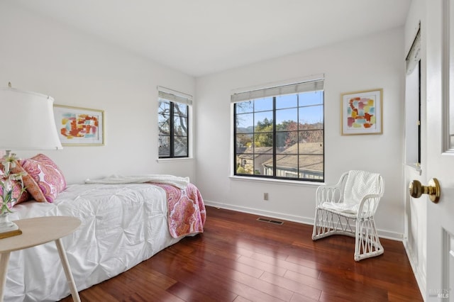 bedroom featuring dark wood-type flooring