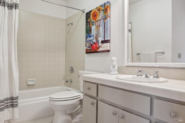 full bathroom with vanity, shower / bath combo with shower curtain, and toilet