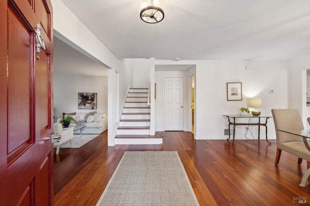 foyer featuring dark wood-type flooring