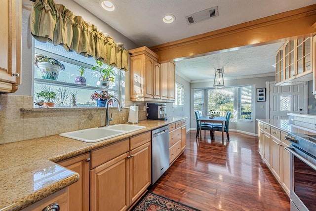 kitchen with visible vents, decorative backsplash, ornamental molding, a sink, and dishwasher