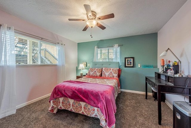 bedroom featuring a textured ceiling, carpet floors, ceiling fan, and baseboards