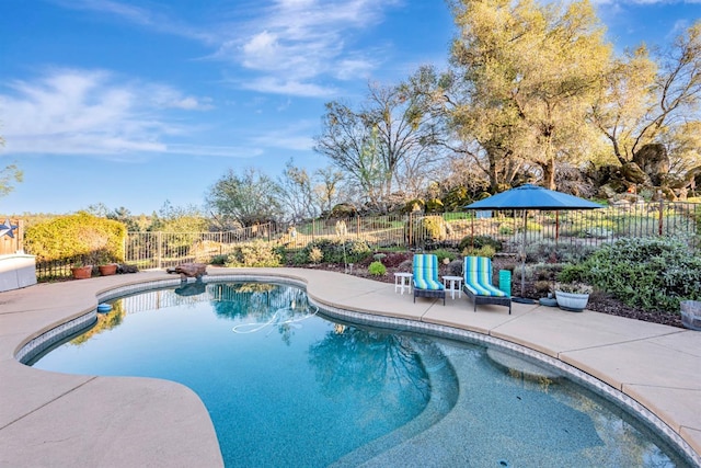 view of pool featuring a patio area, fence, and a fenced in pool