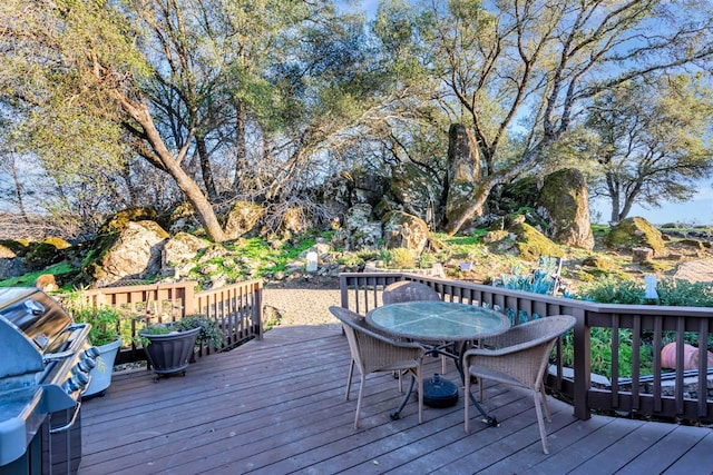 deck with outdoor dining space