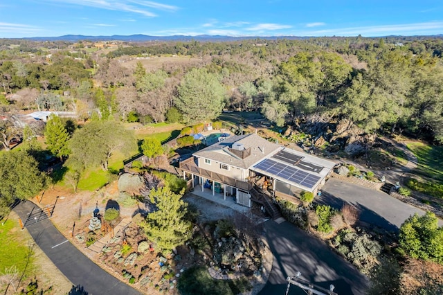 birds eye view of property with a forest view