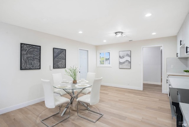 dining space featuring light hardwood / wood-style floors