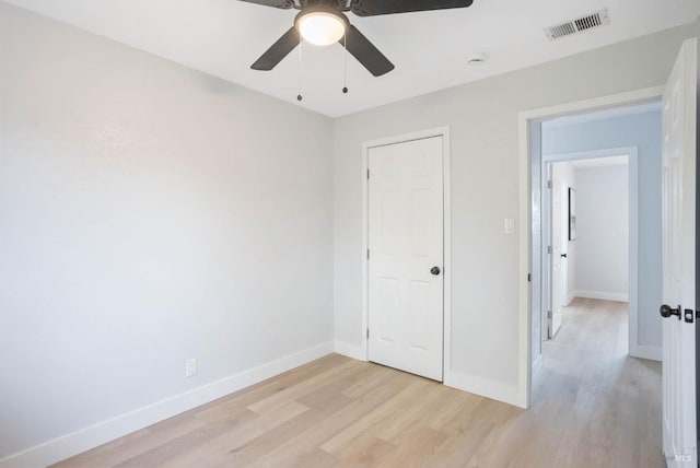 unfurnished bedroom with ceiling fan and light hardwood / wood-style flooring