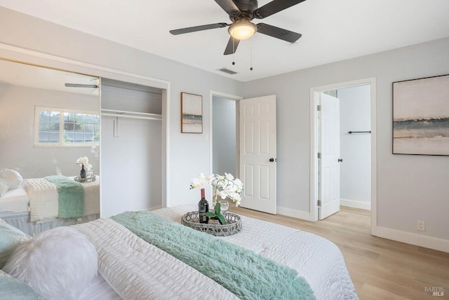 bedroom with a closet, ceiling fan, and light hardwood / wood-style flooring