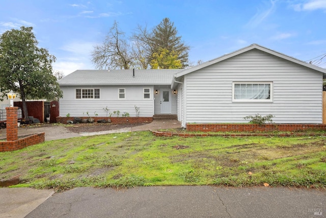 ranch-style house with a front yard