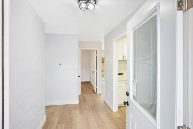 corridor featuring light hardwood / wood-style flooring