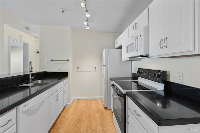 1201 Glen Cove Pkwy Unit 1514, Vallejo, CA 94591 - kitchen with white appliances, a sink, dark countertops, and white cabinets
