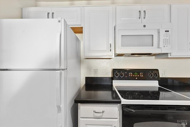 1201 Glen Cove Pkwy Unit 1514, Vallejo, CA 94591 - kitchen featuring white appliances, white cabinets, and dark countertops