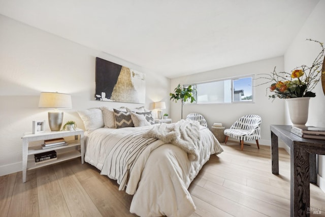 bedroom with light hardwood / wood-style floors