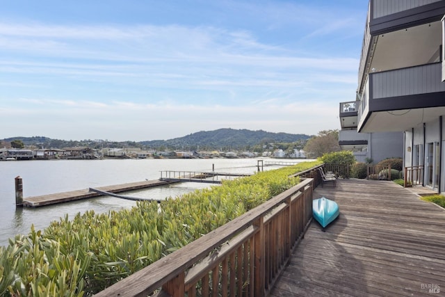 view of dock featuring a water and mountain view