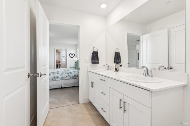 bathroom with tile patterned flooring and vanity