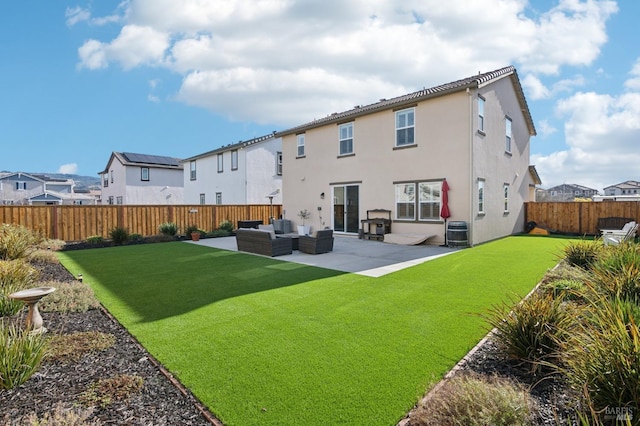 rear view of property with a lawn, a patio, central AC unit, and outdoor lounge area