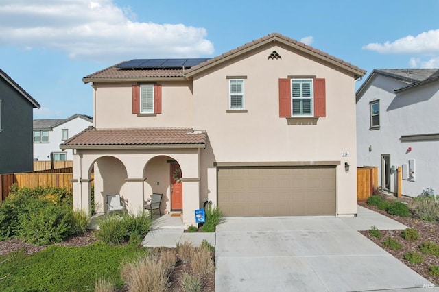 view of front of house with solar panels and a garage