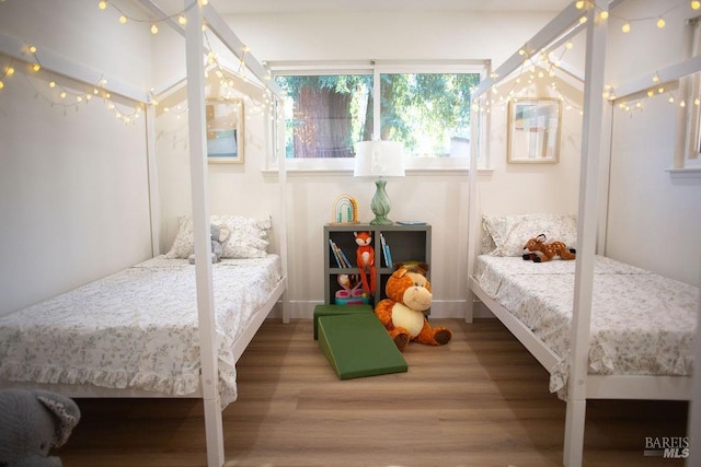 bedroom with wood finished floors