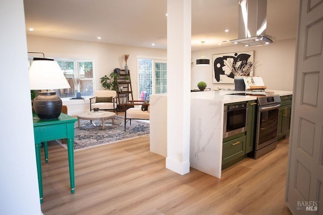 2425 Creekside Ave, Napa, CA 94558 - kitchen featuring island exhaust hood, electric range, light wood finished floors, light stone counters, and recessed lighting