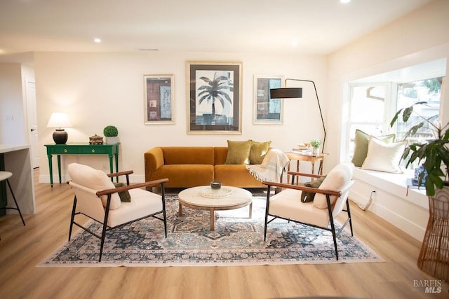 sitting room featuring baseboards, recessed lighting, visible vents, and light wood-style floors