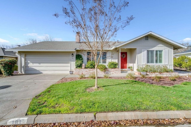 ranch-style house featuring a front yard and a garage