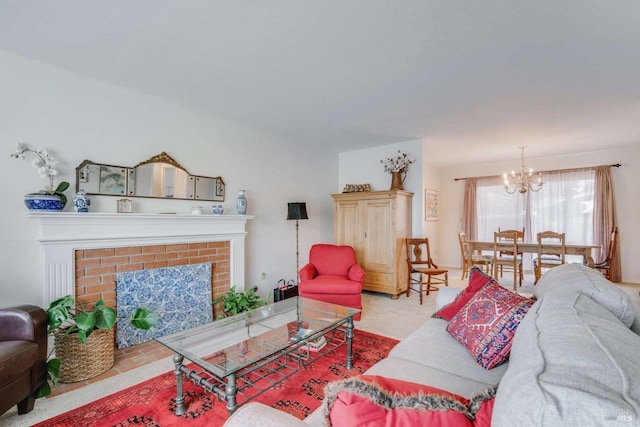 living room featuring a brick fireplace and a chandelier