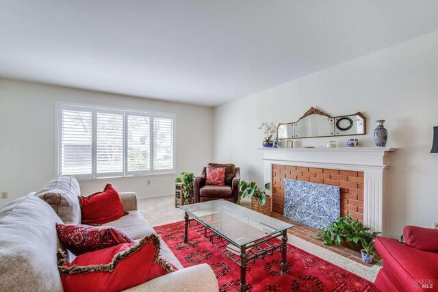 living room featuring a fireplace and carpet floors