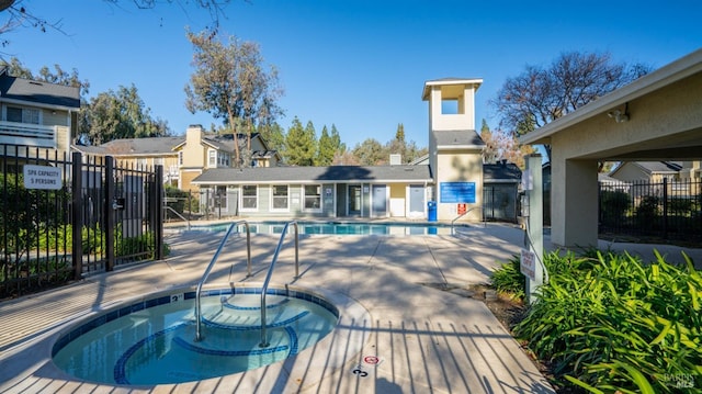 view of pool featuring a community hot tub