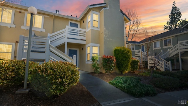 view of outdoor building at dusk