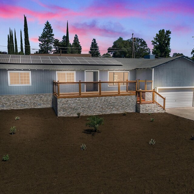 view of front of house with solar panels