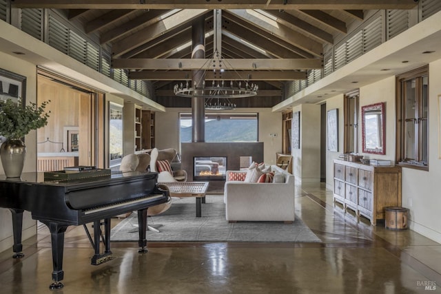 interior space with a wealth of natural light, beam ceiling, high vaulted ceiling, and a chandelier