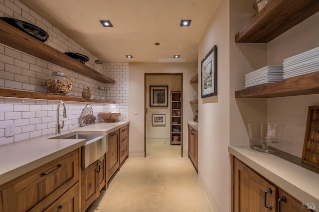 kitchen with tasteful backsplash and sink