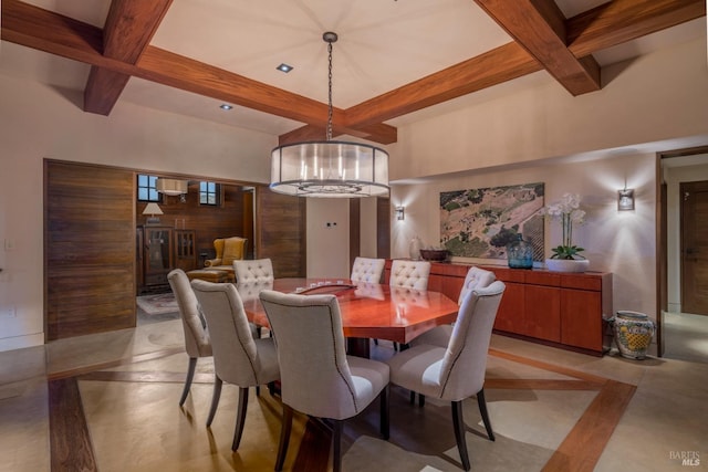 dining area featuring a notable chandelier, wood walls, and beam ceiling